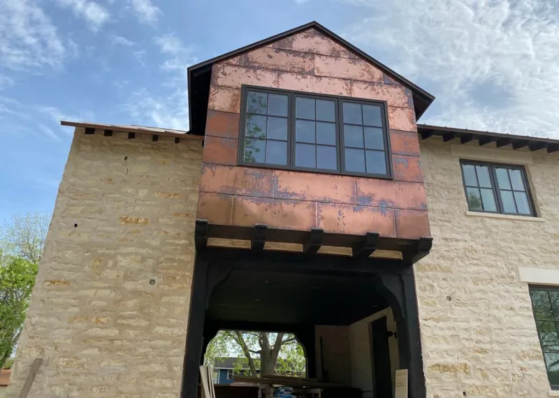 Copper metal panel facade on a stone building for Metal Roof Coating in New Sewickley